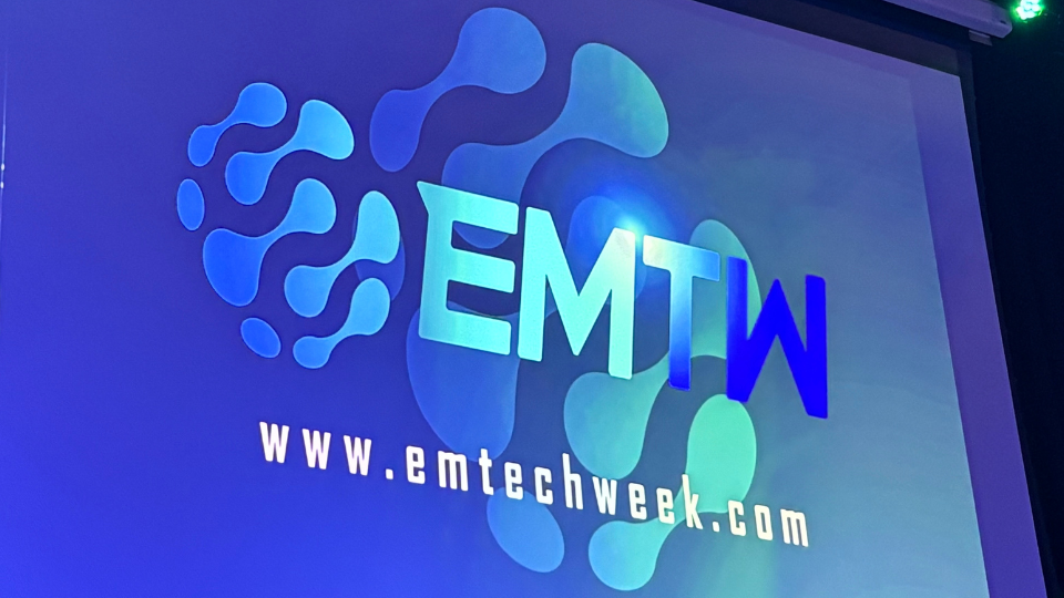 The words East Mids Tech Week appearing on a large screen